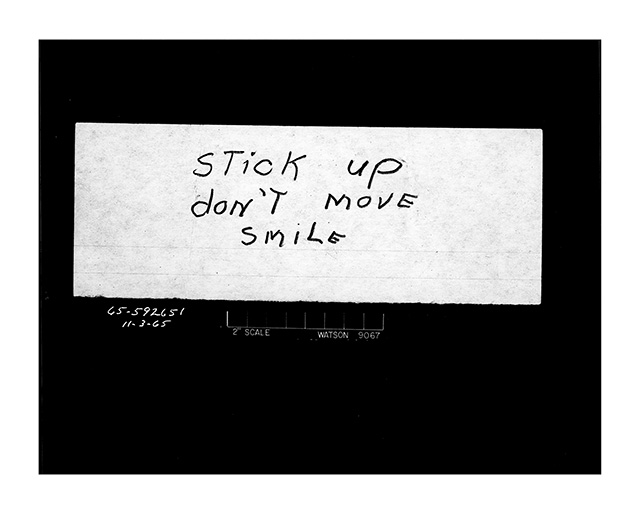 \"Stick up don't move smile\" Bank robbery note. Date: 11/3/1965 Photographer: Unknown
